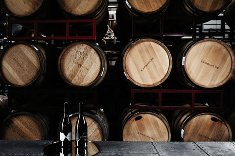 Exprimere wine bottles and wine barrels